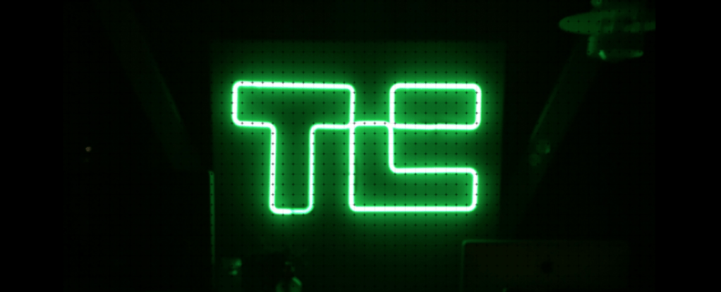 TechCrunch logo in glowing green